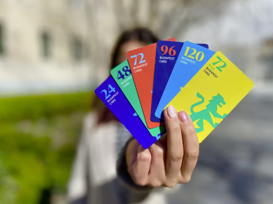 Woman holding different options of the Budapest Card