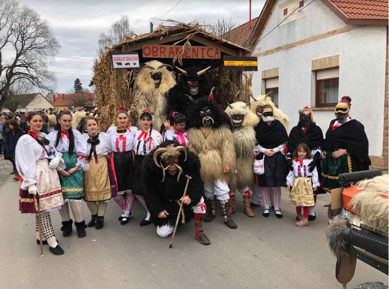 Participants wearing traditional Busójárás masks and costumes in Mohács, representing one of Hungary’s most famous folk festivals.