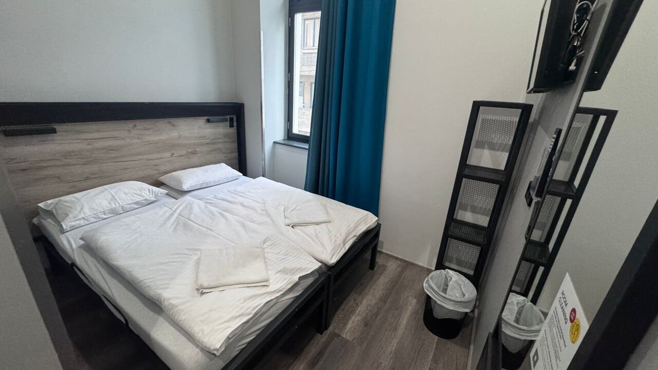 Double room at a&o Hostel Budapest with comfortable bed, a private room option for where to stay in Budapest