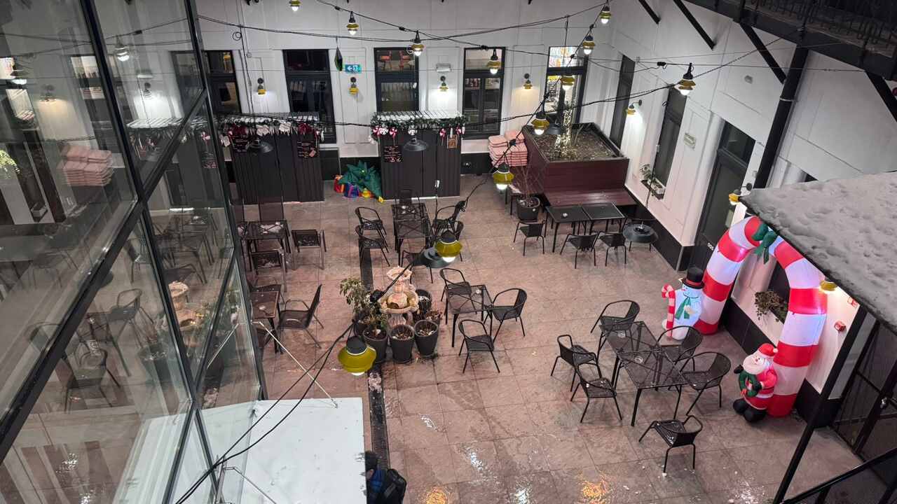 Terrace at a&o Hostel Budapest with tables, a social space for guests to relax and hang out